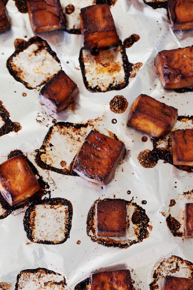 A baking sheet has been used to make a marinated, baked plant protein. The protein has a dark glaze.