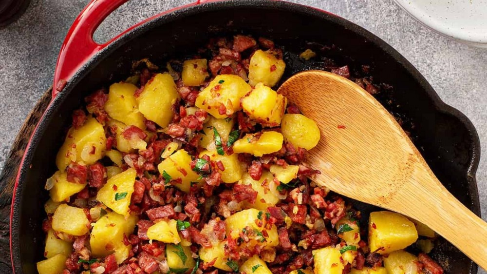 A cast iron skillet with homemade corned beef hash