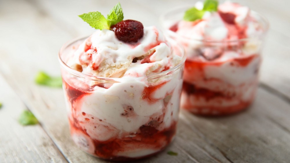 Two containers of a yogurt dessert